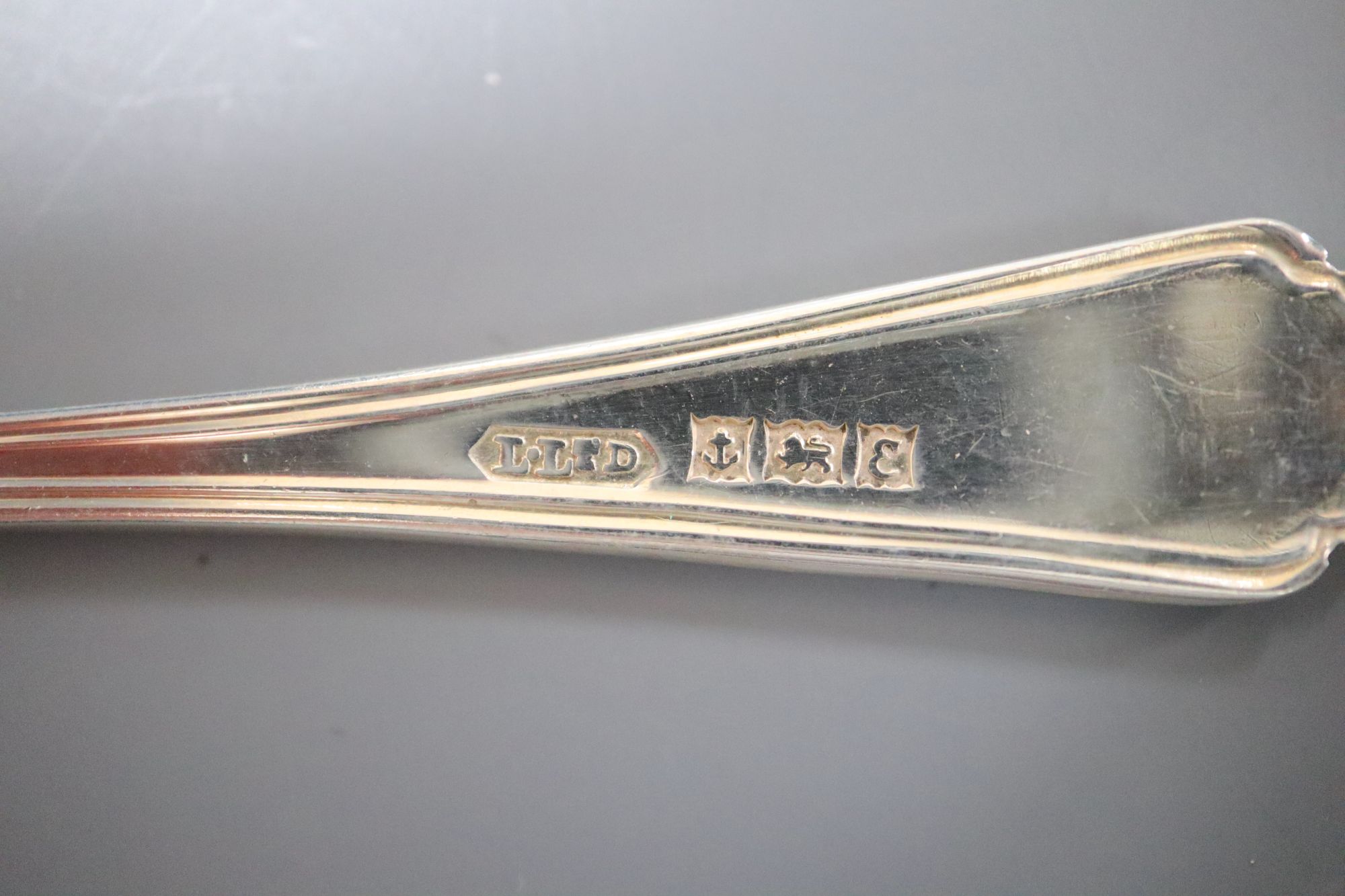 A cased set of six mid 20th century silver teaspoons and six similar coffee spoons.